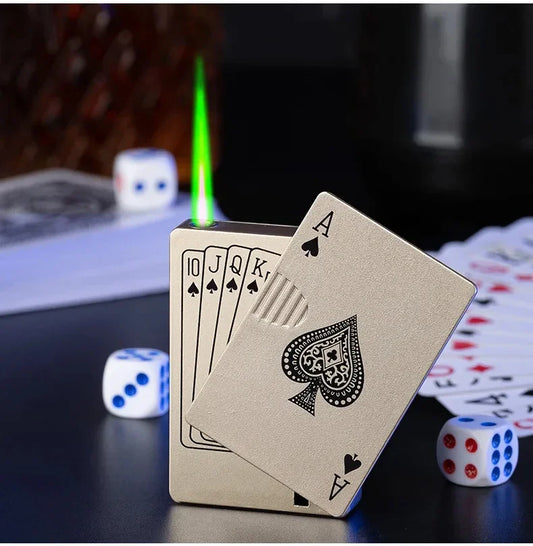 Playing cards with a lighter and dice on a dark surface