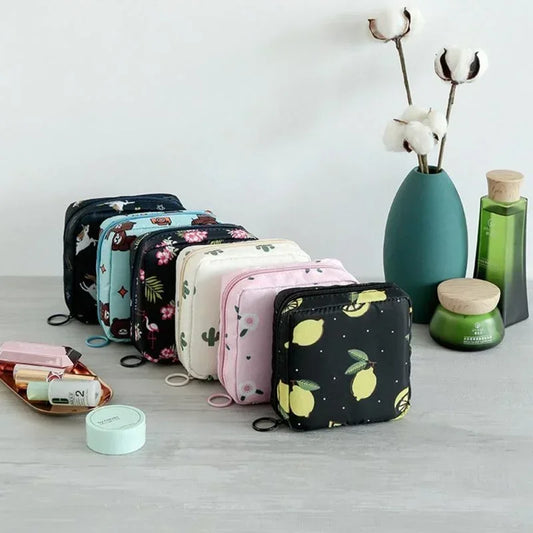Set of small bags with various patterns on a light surface with decorative items.